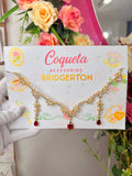 Juego aros + collar bridgerton dorado con gema roja